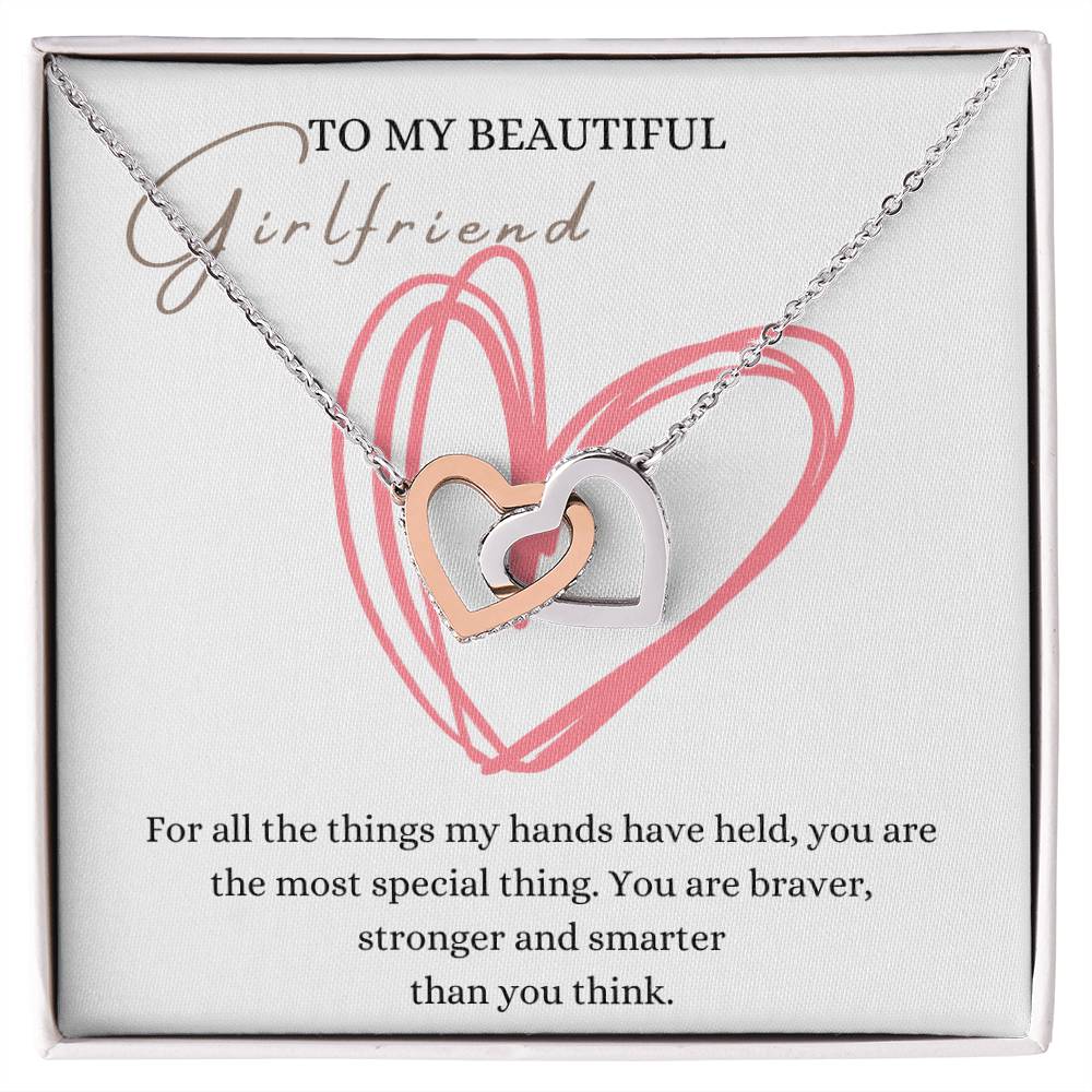 A necklace gift in a Jewelry box, with ribbon shaped pendant with cubic zirconia crystals and white gold finish, with a message card to my beautiful girlfriend. 